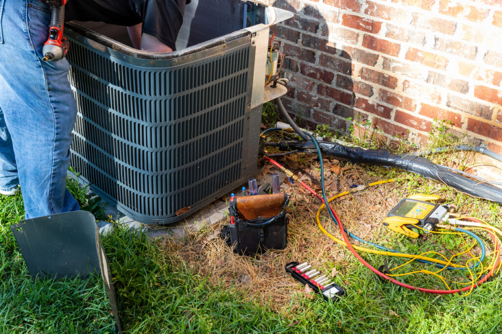 Technician working on an air conditioner